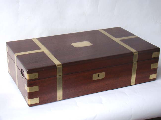 An outstanding English brass bound 'flame' mahogany gun or instrument box circa 1835